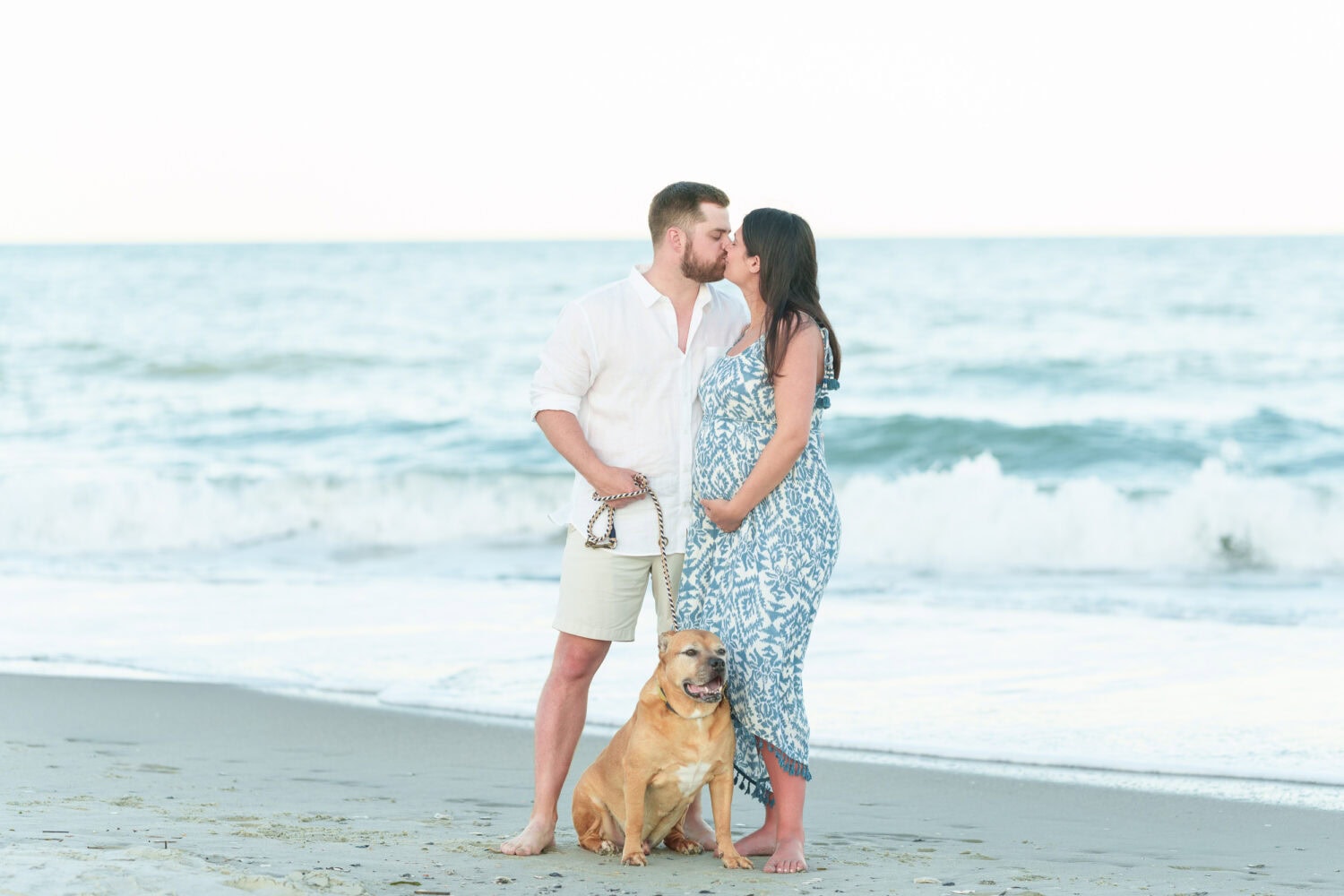 Maternity photos with their dog on the beach - Pawleys Island Beach House