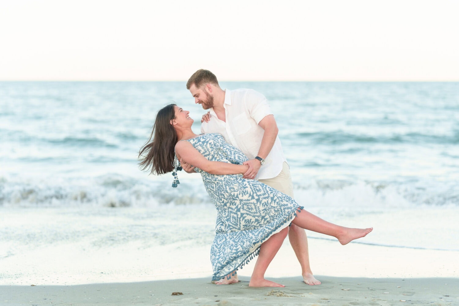 Maternity photos with their dog on the beach - Pawleys Island Beach House