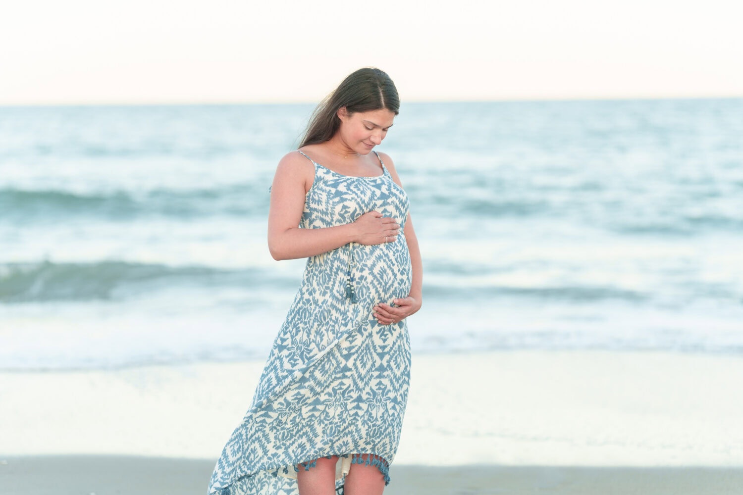 Maternity photos with their dog on the beach - Pawleys Island Beach House