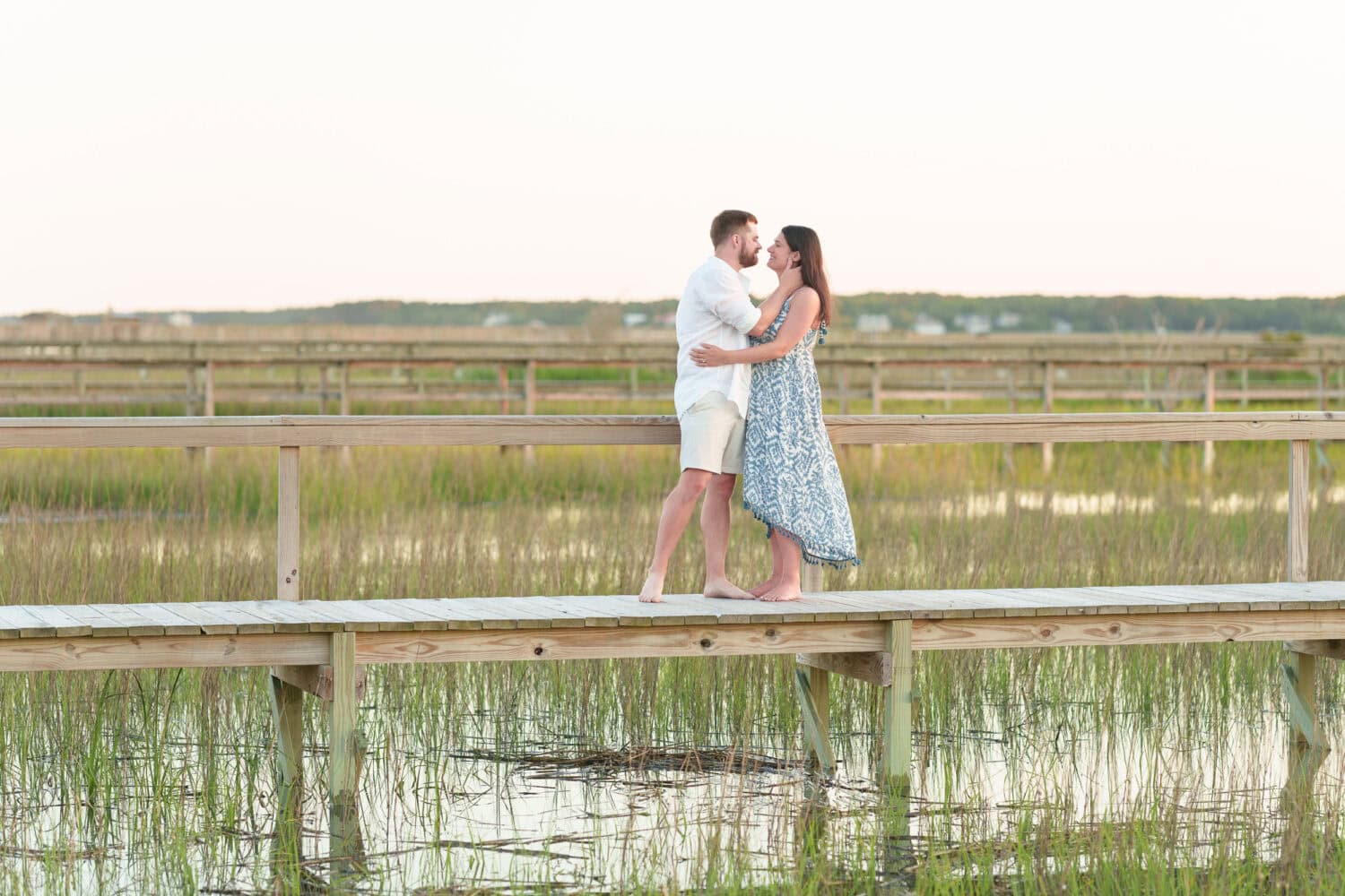 Maternity photos with their dog on the beach - Pawleys Island Beach House