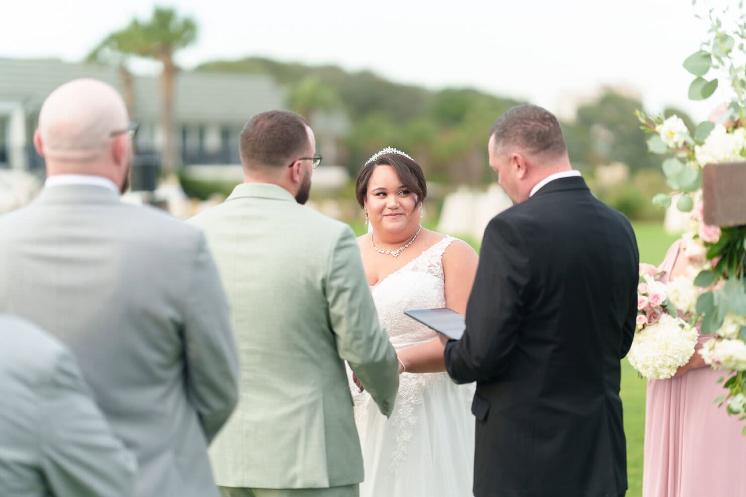 Bride listening to the ceremony - Dunes Golf & Beach Club