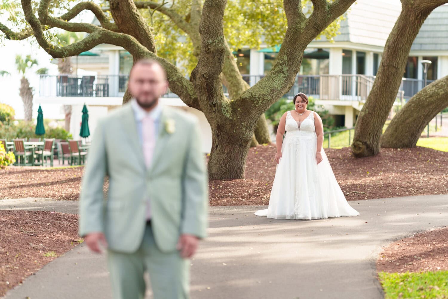 Bride walking towards the groom for a first look - Dunes Golf & Beach Club