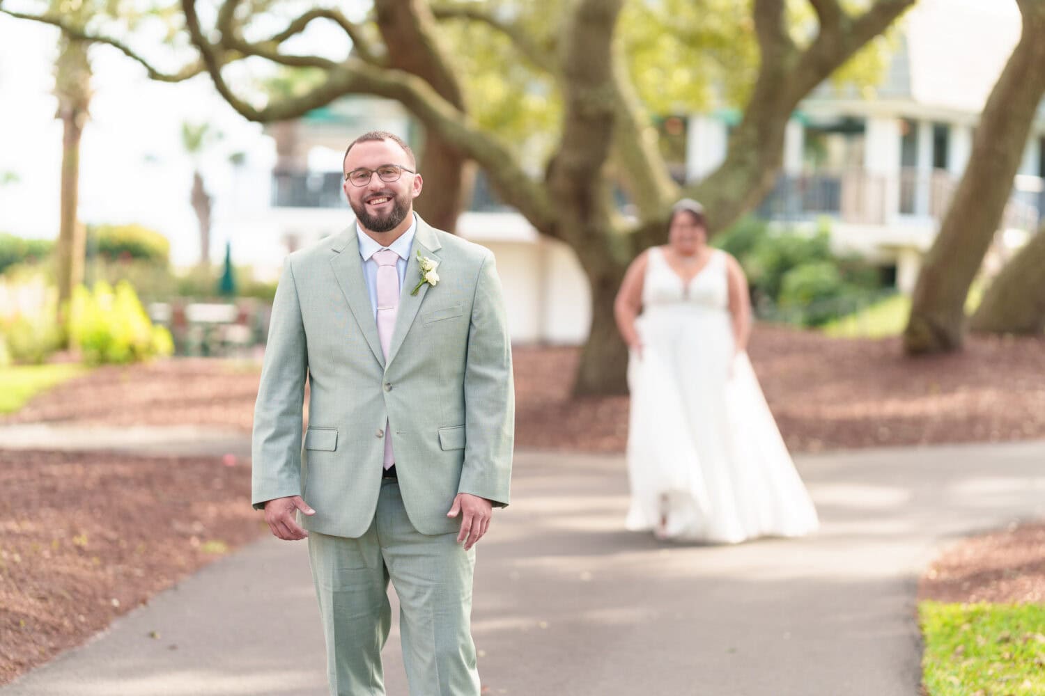 Bride walking towards the groom for a first look - Dunes Golf & Beach Club