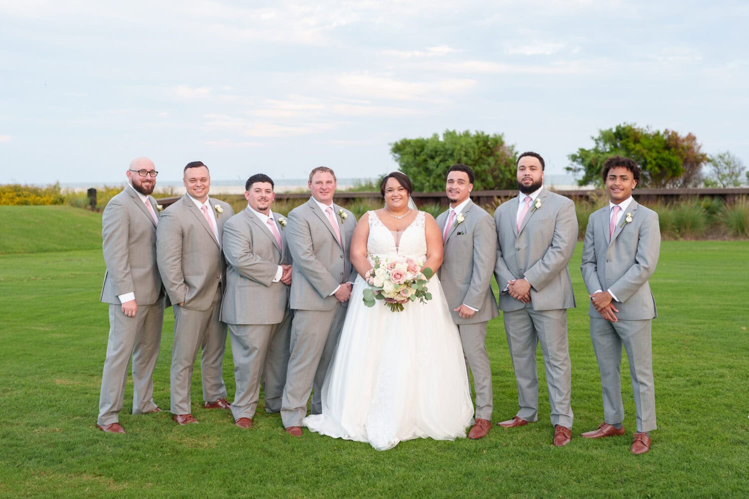 Bride with the groomsmen - Dunes Golf & Beach Club