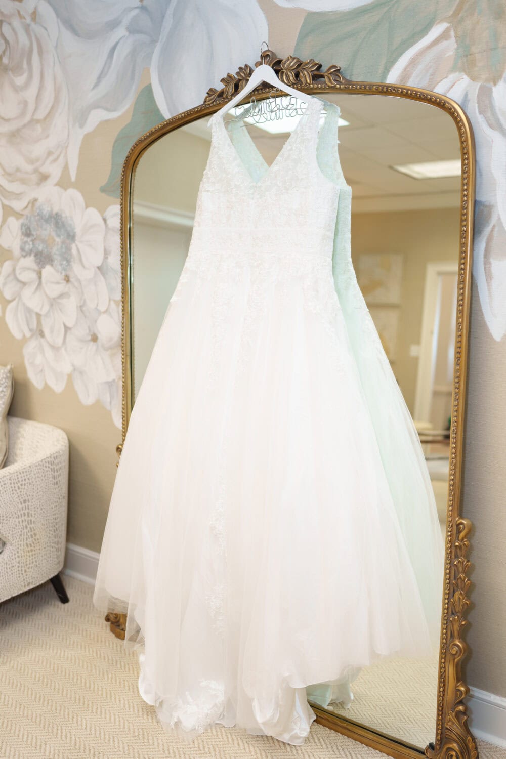 Bride's dress hanging on the mirror - Dunes Golf & Beach Club