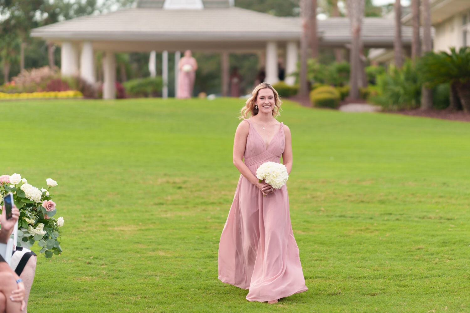 Family and wedding party walking to the ceremony - Dunes Golf & Beach Club