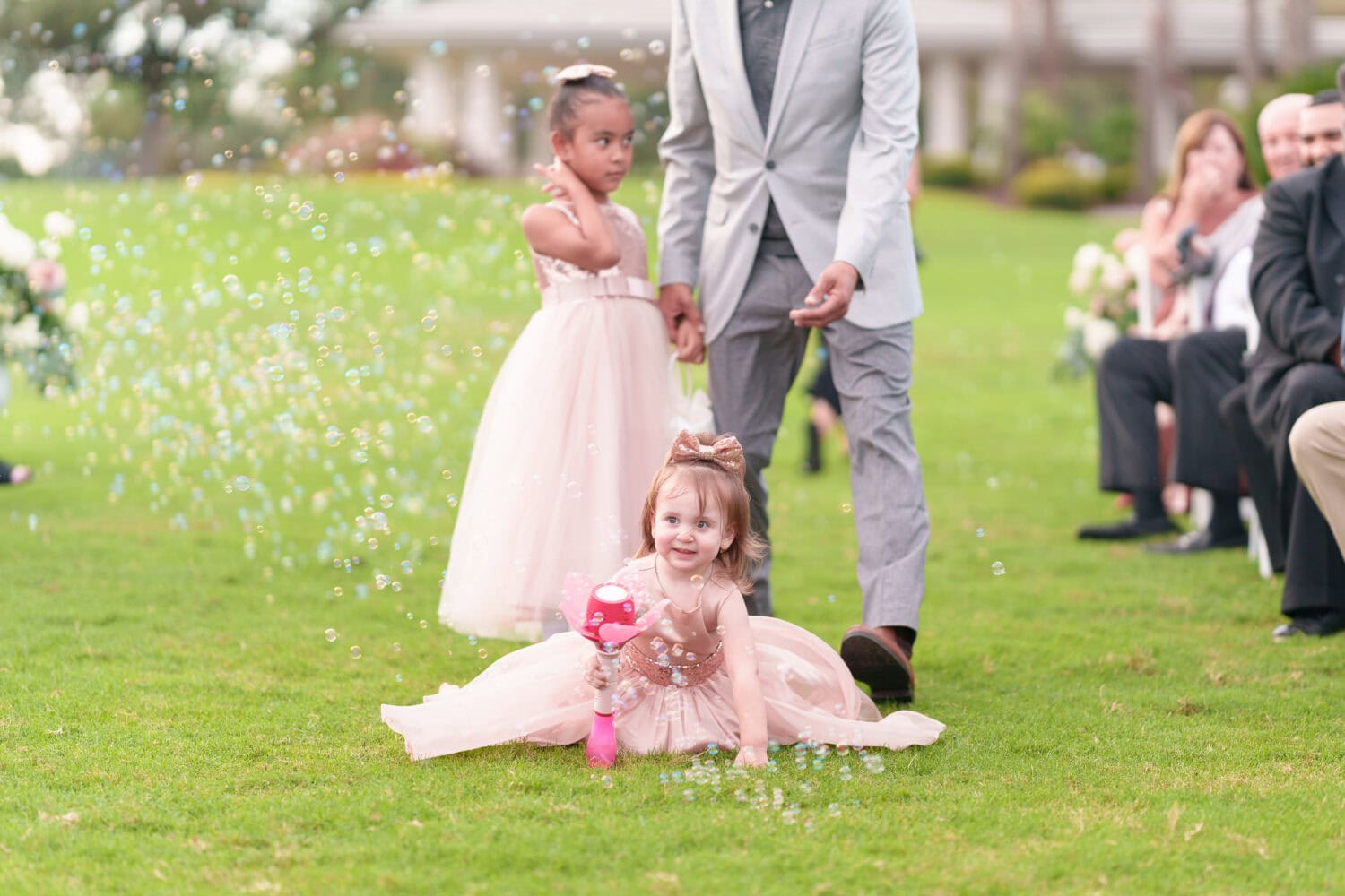 Flower girls holding the bubble machines - Dunes Golf & Beach Club