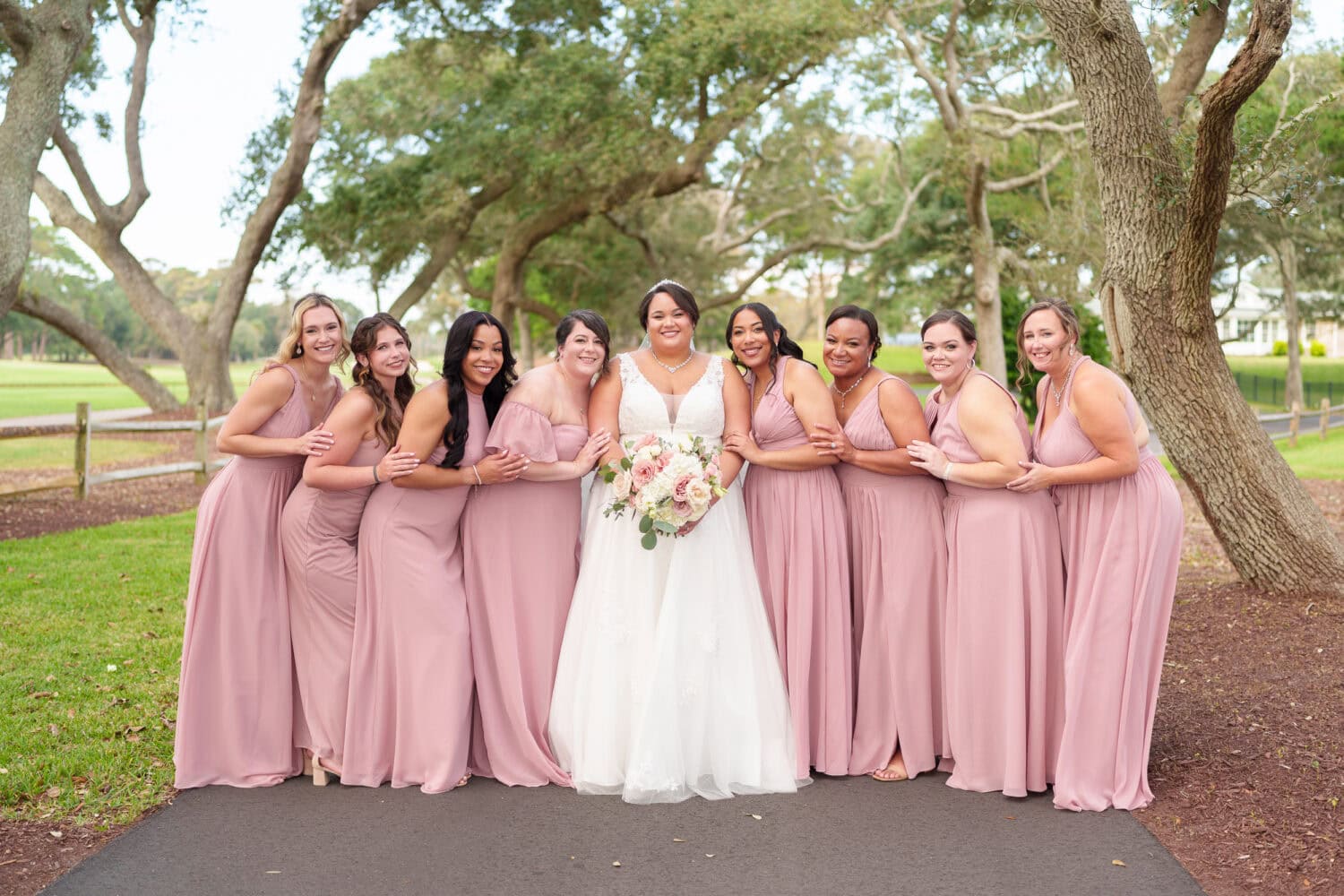 Fun pictures with the bride and her 8 bridesmaids before the ceremony - Dunes Golf & Beach Club