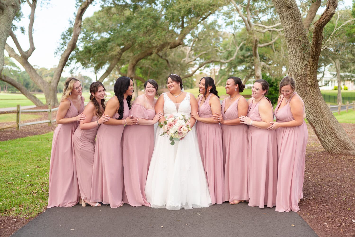 Fun pictures with the bride and her 8 bridesmaids before the ceremony - Dunes Golf & Beach Club