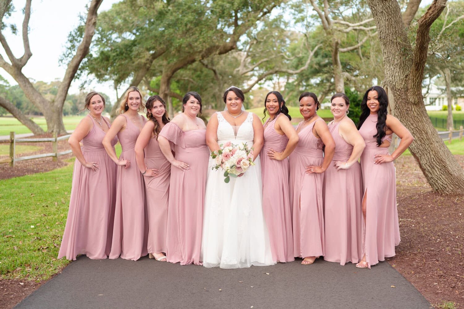 Fun pictures with the bride and her 8 bridesmaids before the ceremony - Dunes Golf & Beach Club