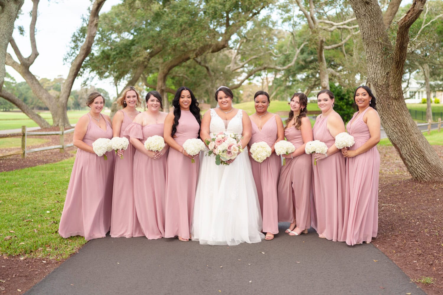 Fun pictures with the bride and her 8 bridesmaids before the ceremony - Dunes Golf & Beach Club