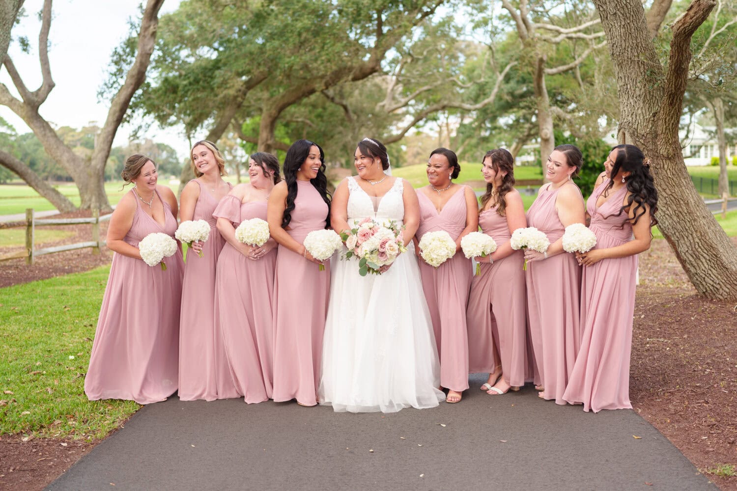 Fun pictures with the bride and her 8 bridesmaids before the ceremony - Dunes Golf & Beach Club