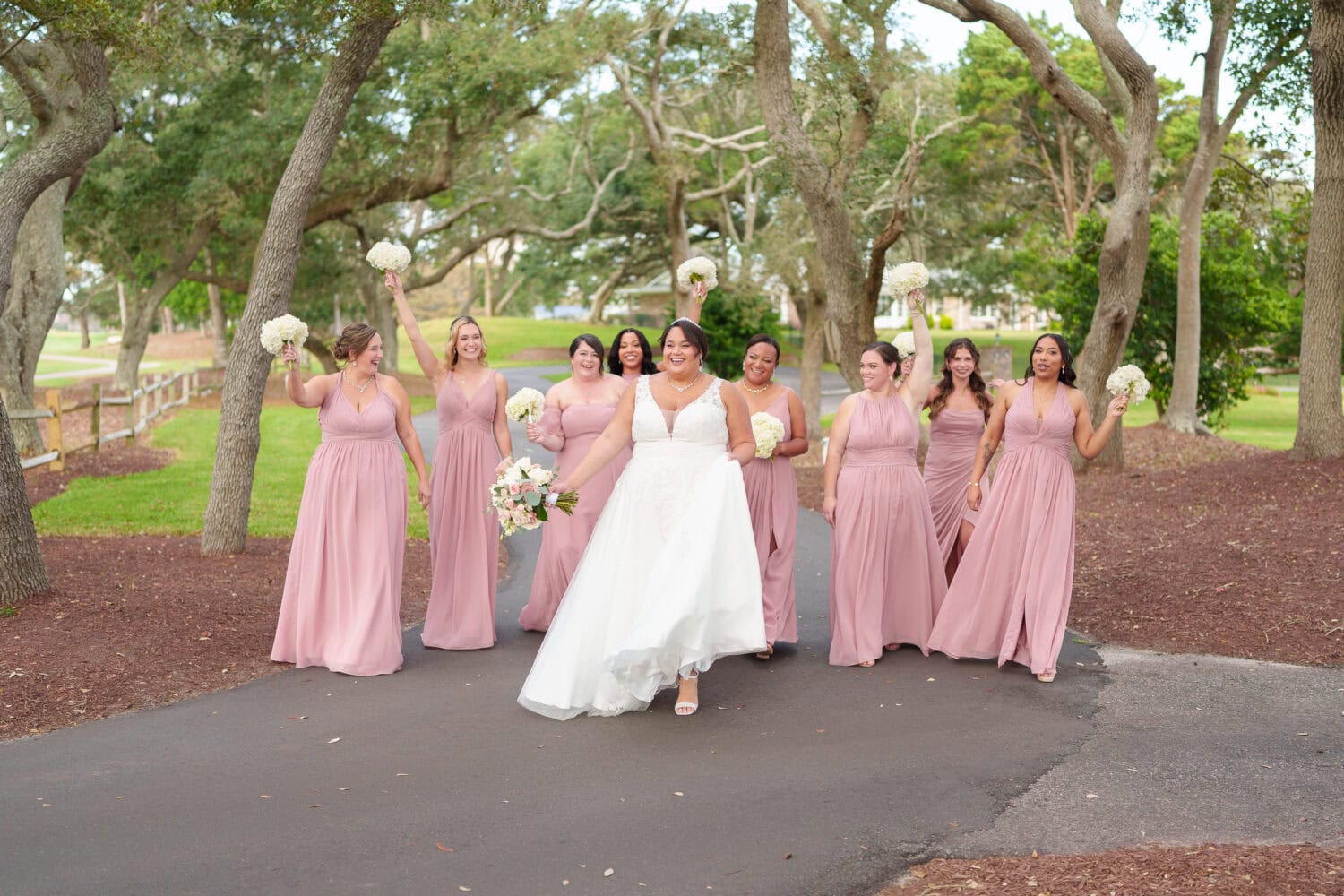 Fun pictures with the bride and her 8 bridesmaids before the ceremony - Dunes Golf & Beach Club