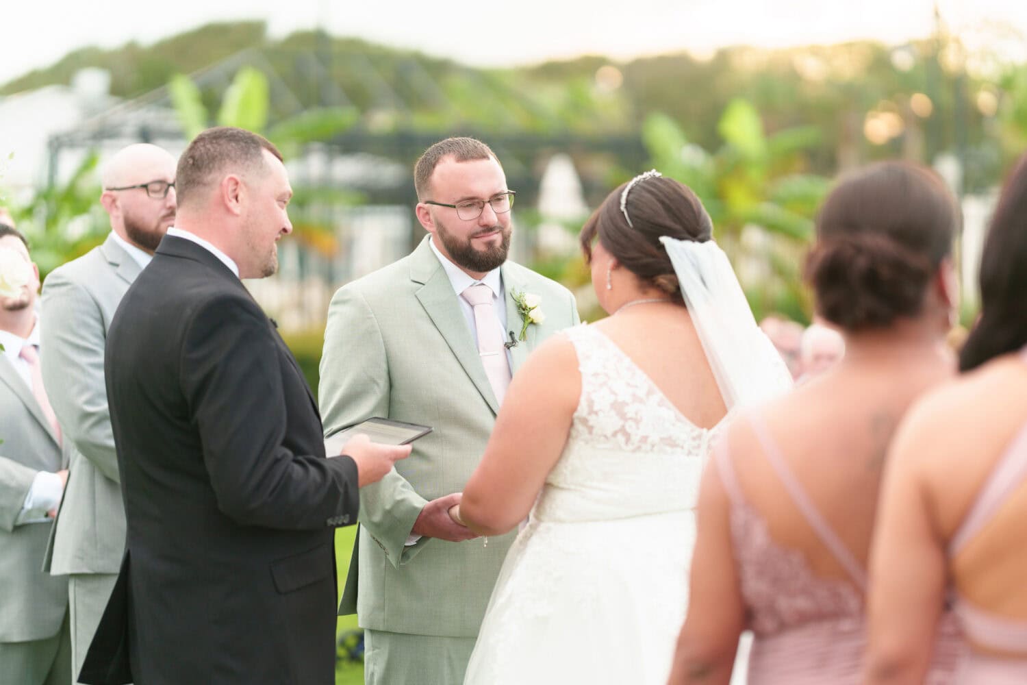 Groom looking at bride during the vows - Dunes Golf & Beach Club