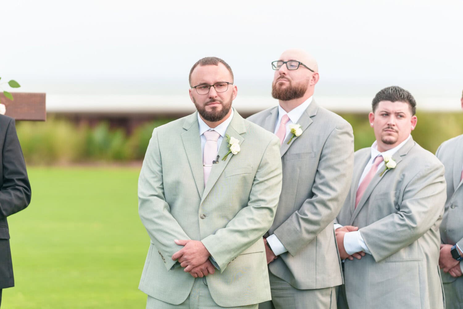 Groom watching bride down the aisle - Dunes Golf & Beach Club