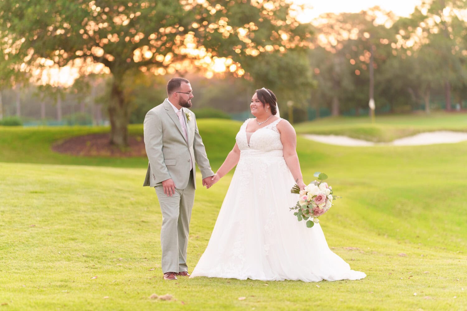 Holding hands in the sunset - Dunes Golf & Beach Club