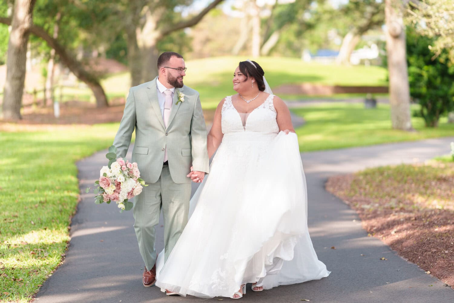 Holding hands walking together - Dunes Golf & Beach Club