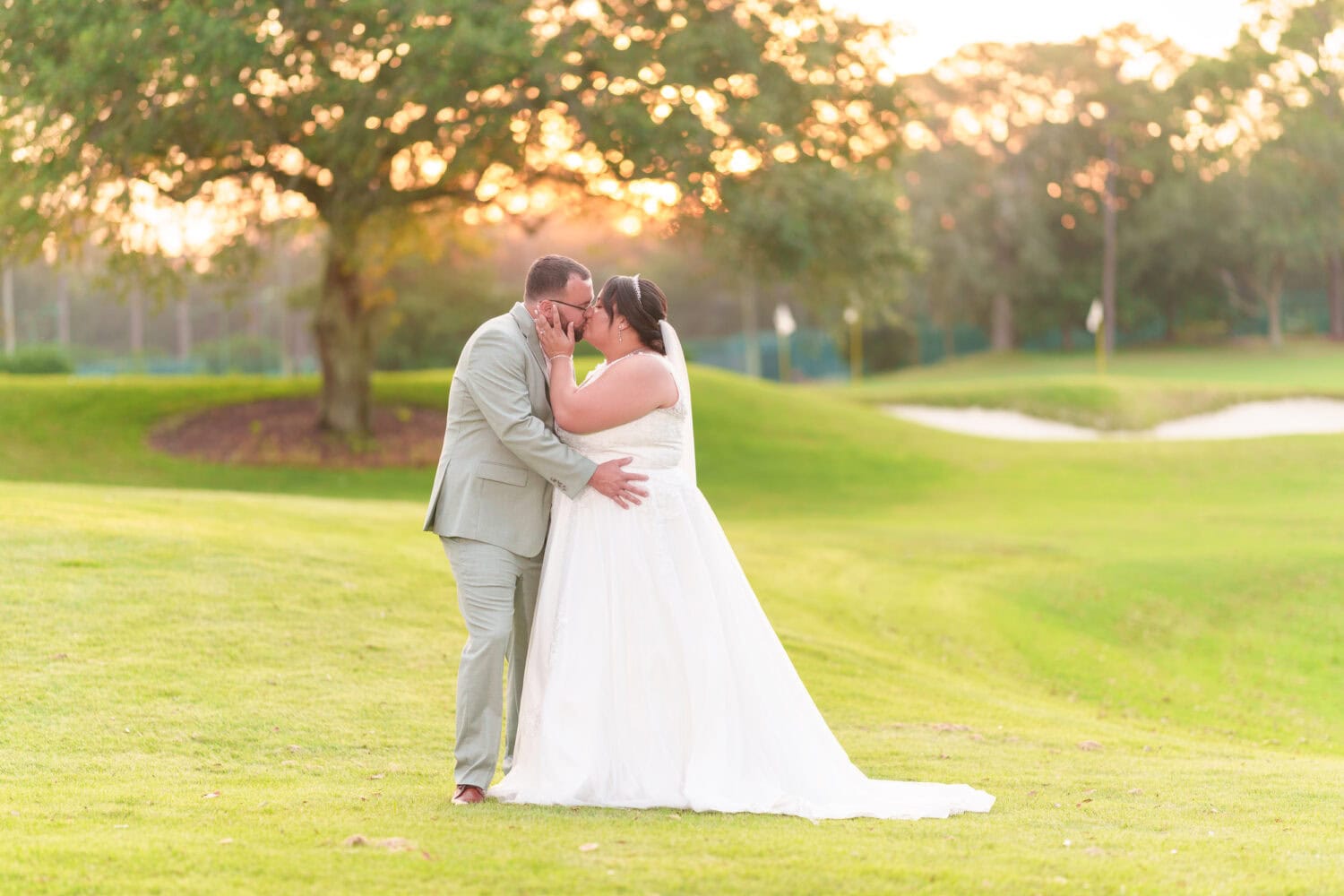 Kiss in the sunset on the golf course - Dunes Golf & Beach Club