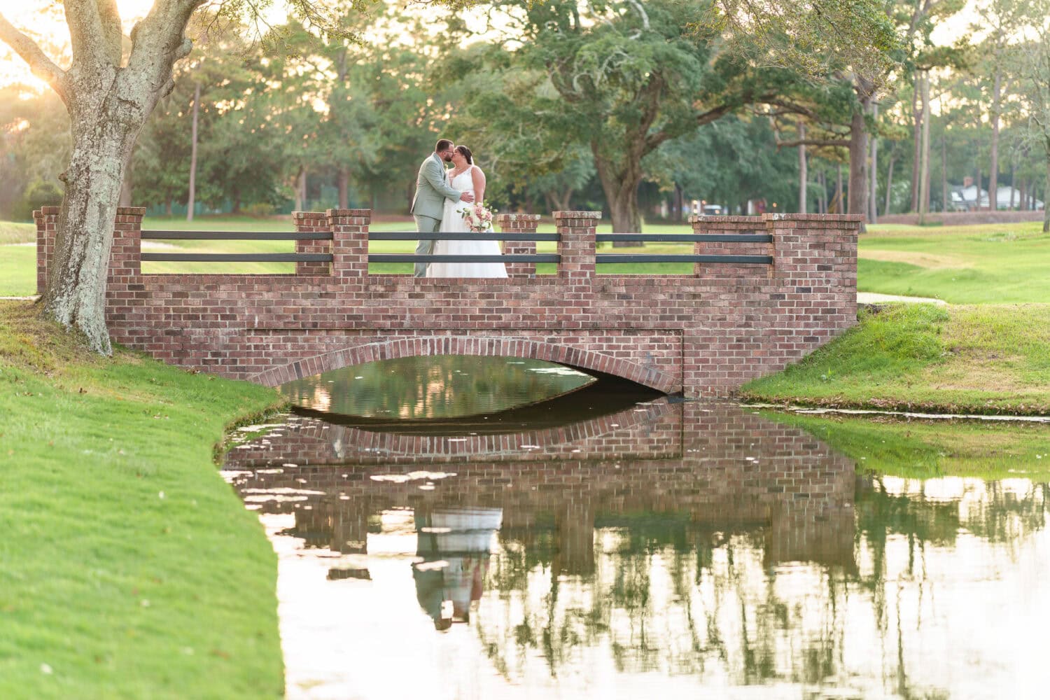 Kiss on the golf course bridge - Dunes Golf & Beach Club