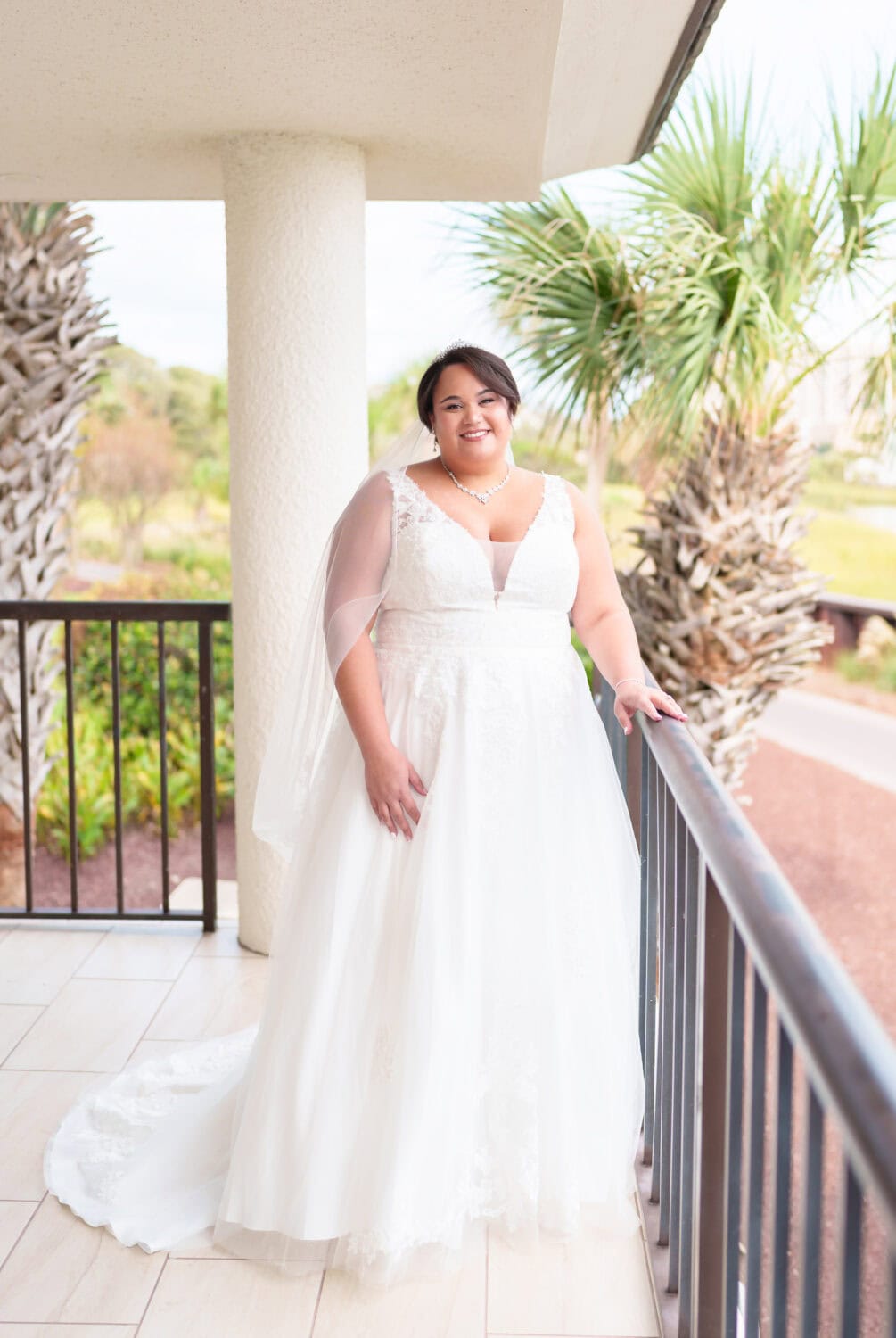 Portraits of bride standing on the balcony - Dunes Golf & Beach Club