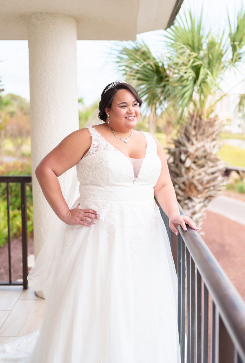 Portraits of bride standing on the balcony - Dunes Golf & Beach Club