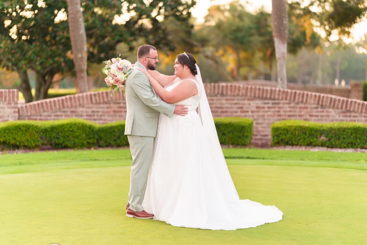 Portraits on the practice green with the sunset in the background - Dunes Golf & Beach Club