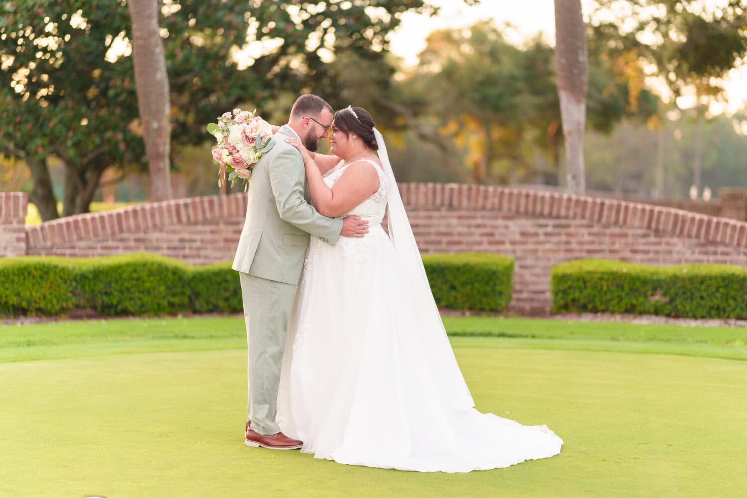 Portraits on the practice green with the sunset in the background - Dunes Golf & Beach Club