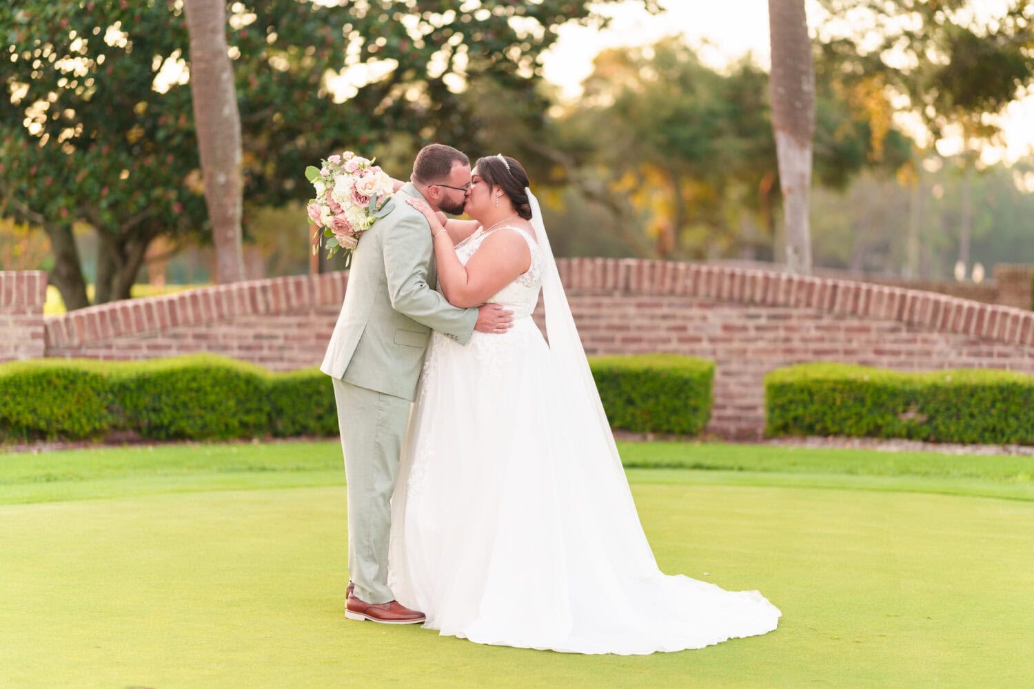 Portraits on the practice green with the sunset in the background - Dunes Golf & Beach Club