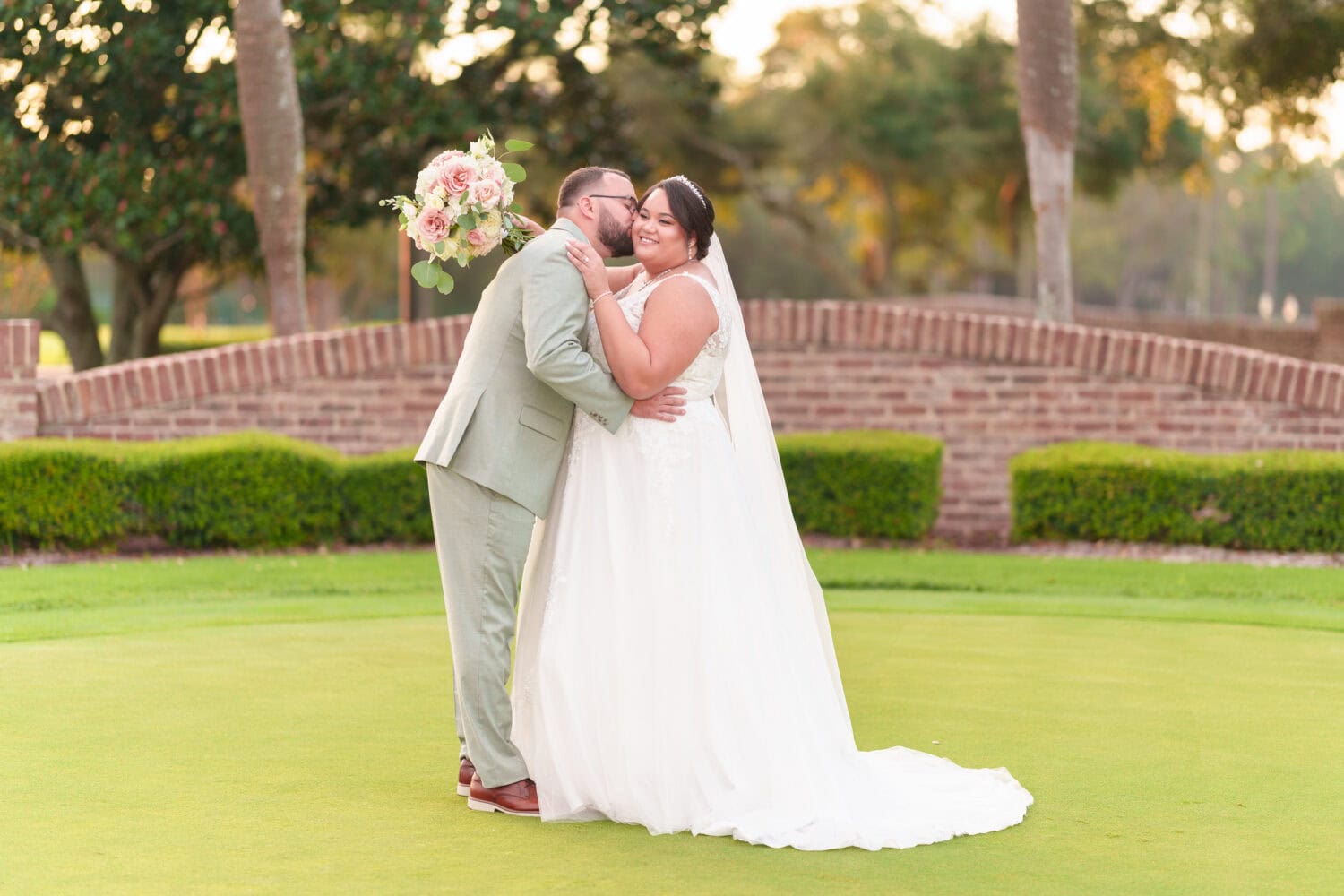 Portraits on the practice green with the sunset in the background - Dunes Golf & Beach Club