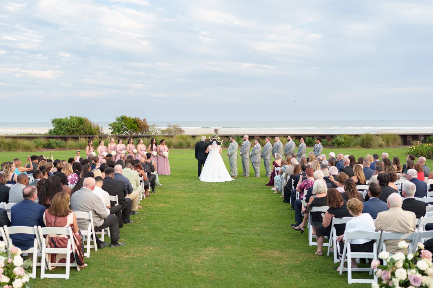 Wide angle shots of the ceremony on the lawn - Dunes Golf & Beach Club