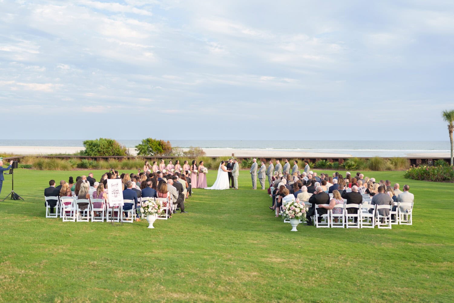 Wide angle shots of the ceremony on the lawn - Dunes Golf & Beach Club