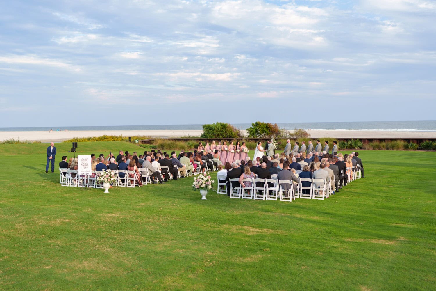 Wide angle shots of the ceremony on the lawn - Dunes Golf & Beach Club