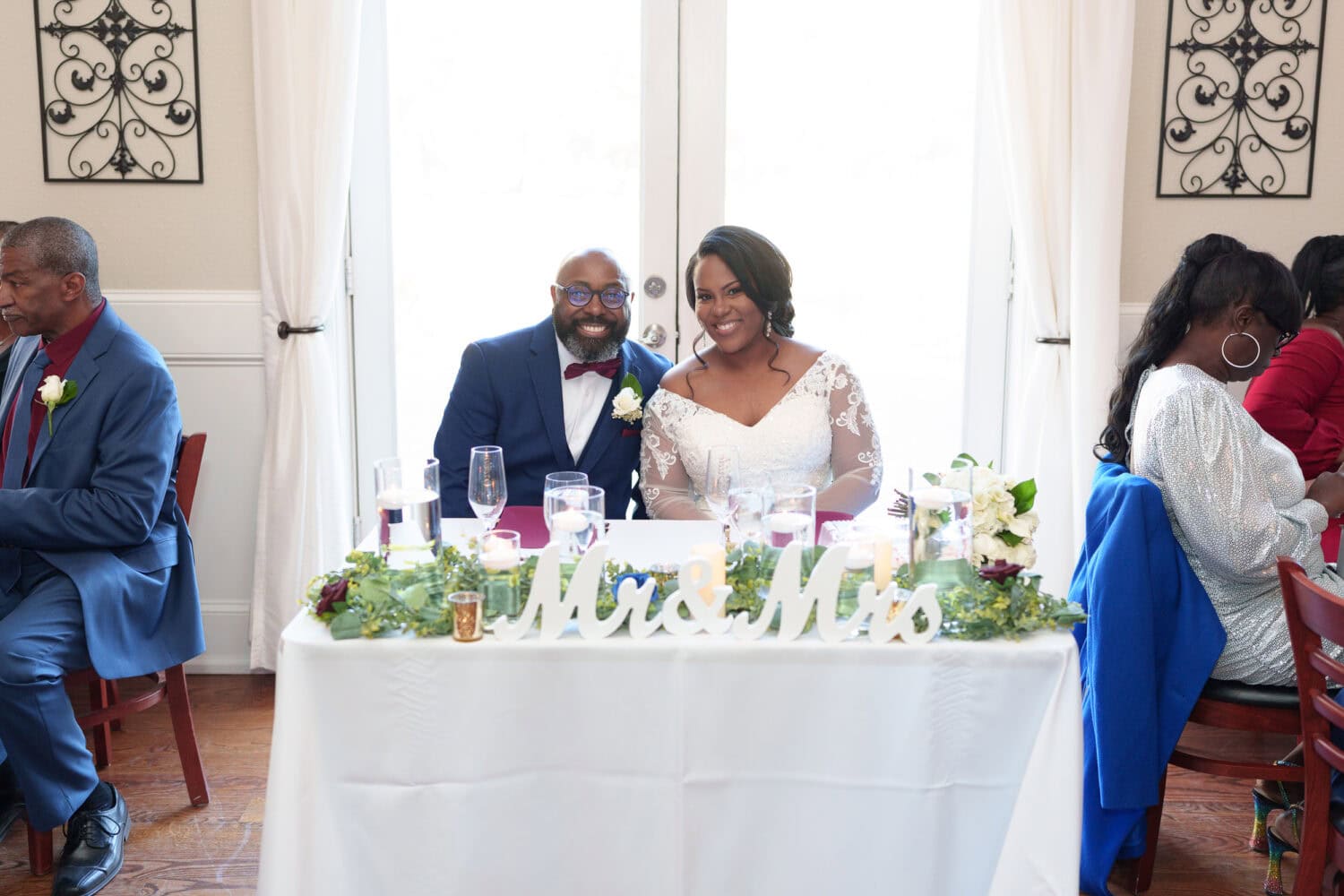 Bride and groom at the table - Wedgefield Country Club