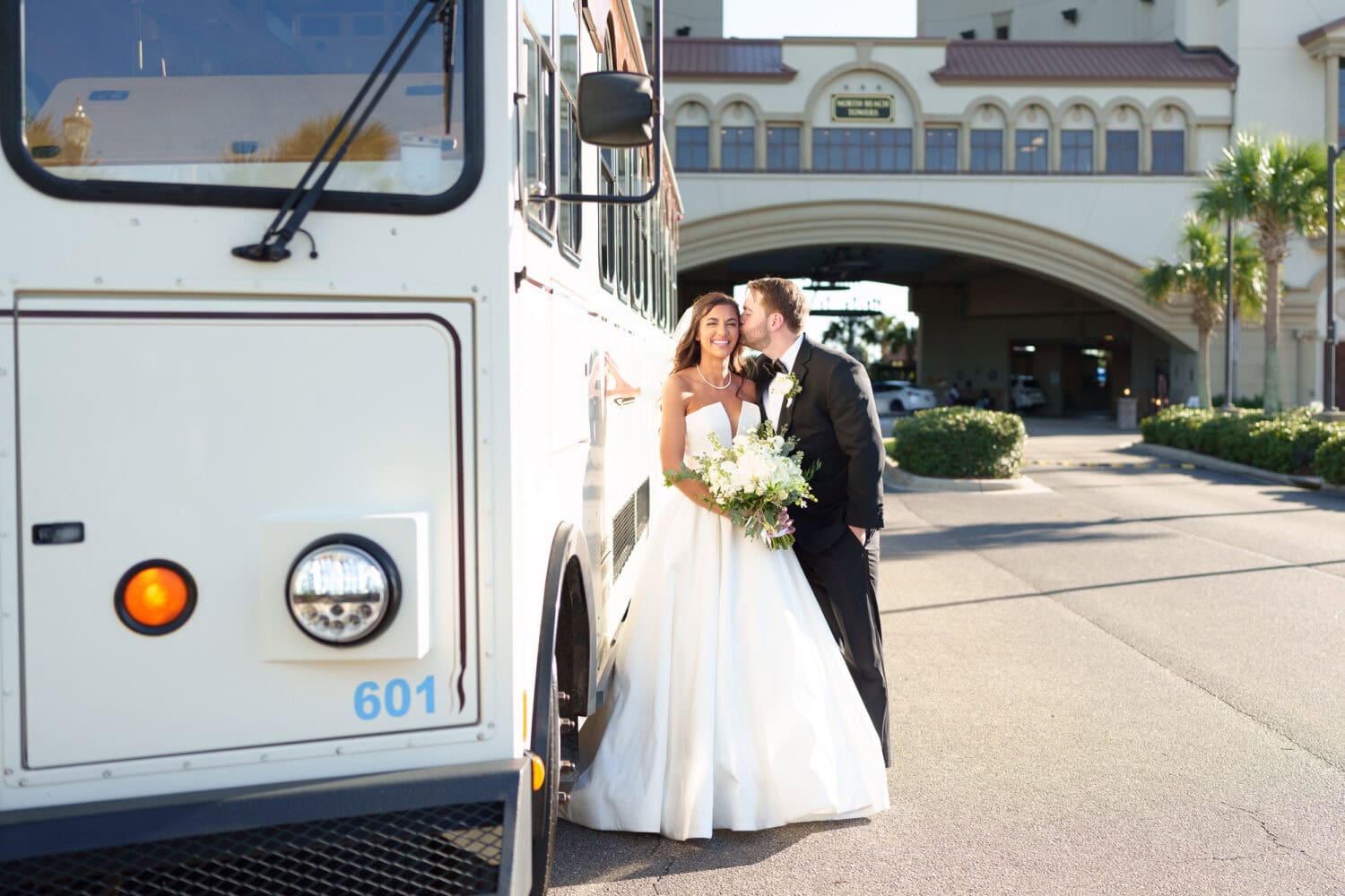 Bride and groom by the trolly - 21 Main Events - North Myrtle Beach