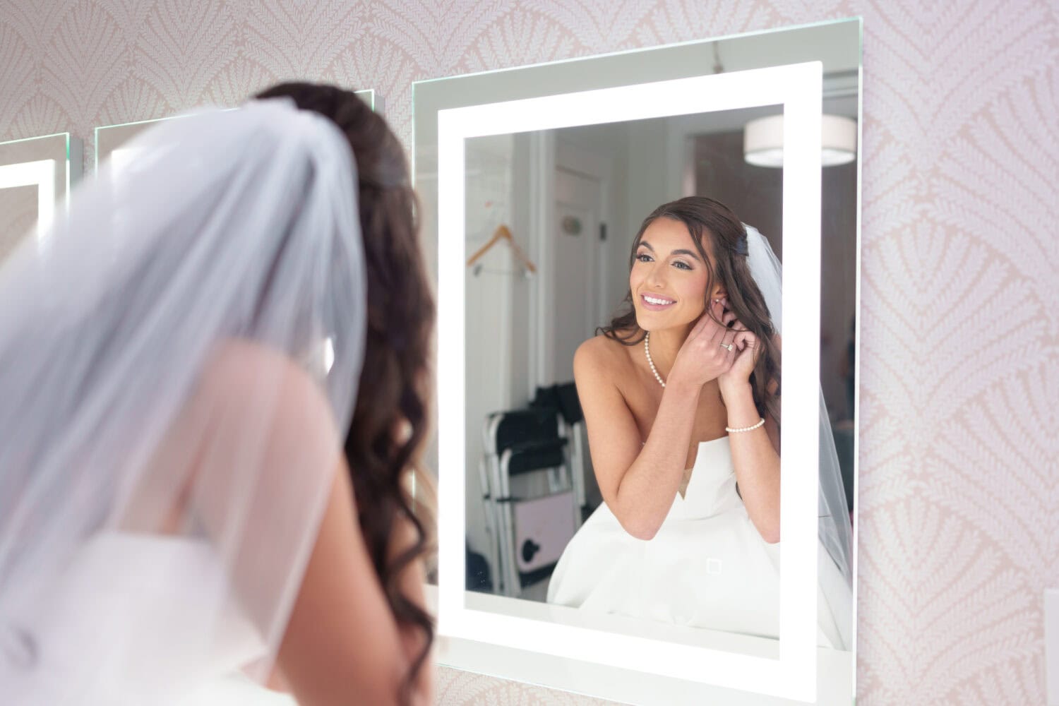 Bride putting on her earrings - 21 Main Events - North Myrtle Beach