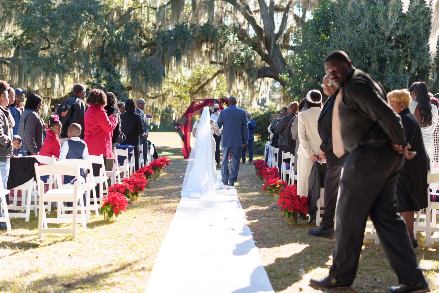 Bride walking down the aisle with her father - Wedgefield Country Club