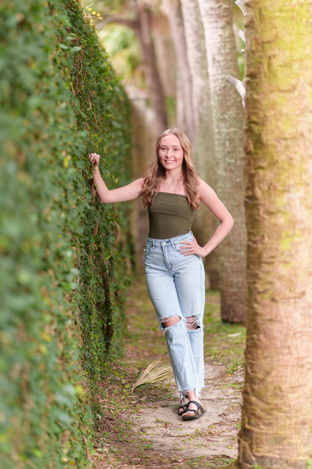 High school senior portrait by ivy wall - Huntington Beach State Park - Pawleys Island