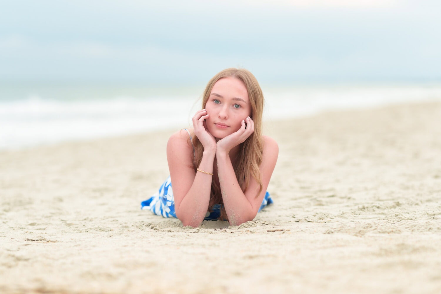 High school senior portrait laying in the sand - Huntington Beach State Park - Pawleys Island