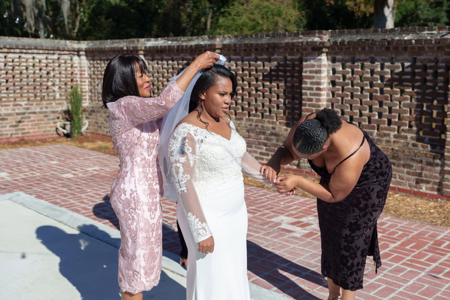 Mom helping bride with her veil - Wedgefield Country Club