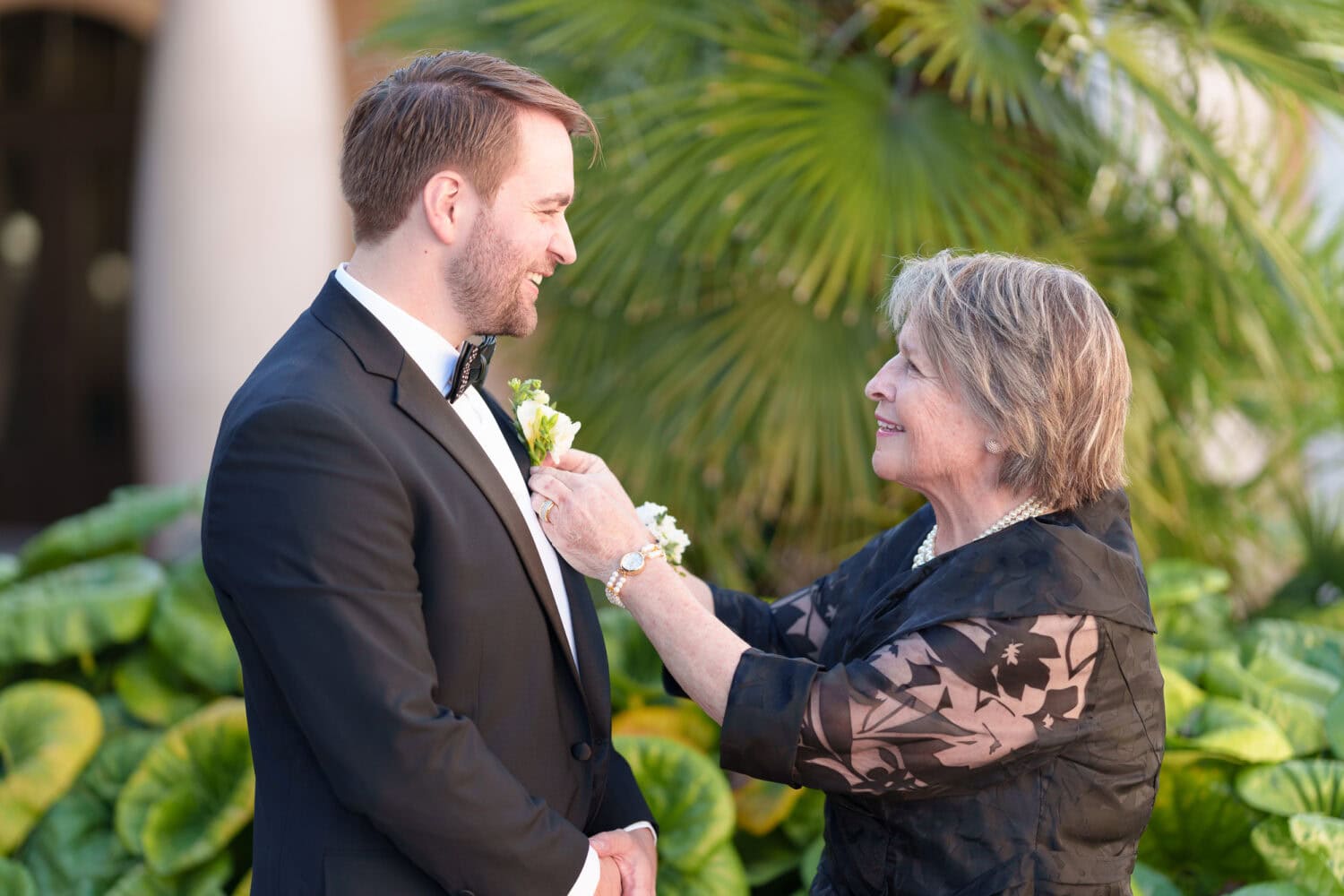 Mom helping groom put on his boutonniere  - 21 Main Events - North Myrtle Beach