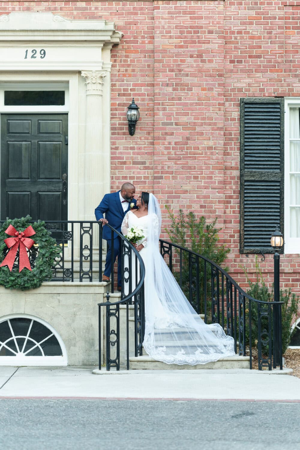 Portraits in front of the clubhouse steps with the bride and groom - Wedgefield Country Club