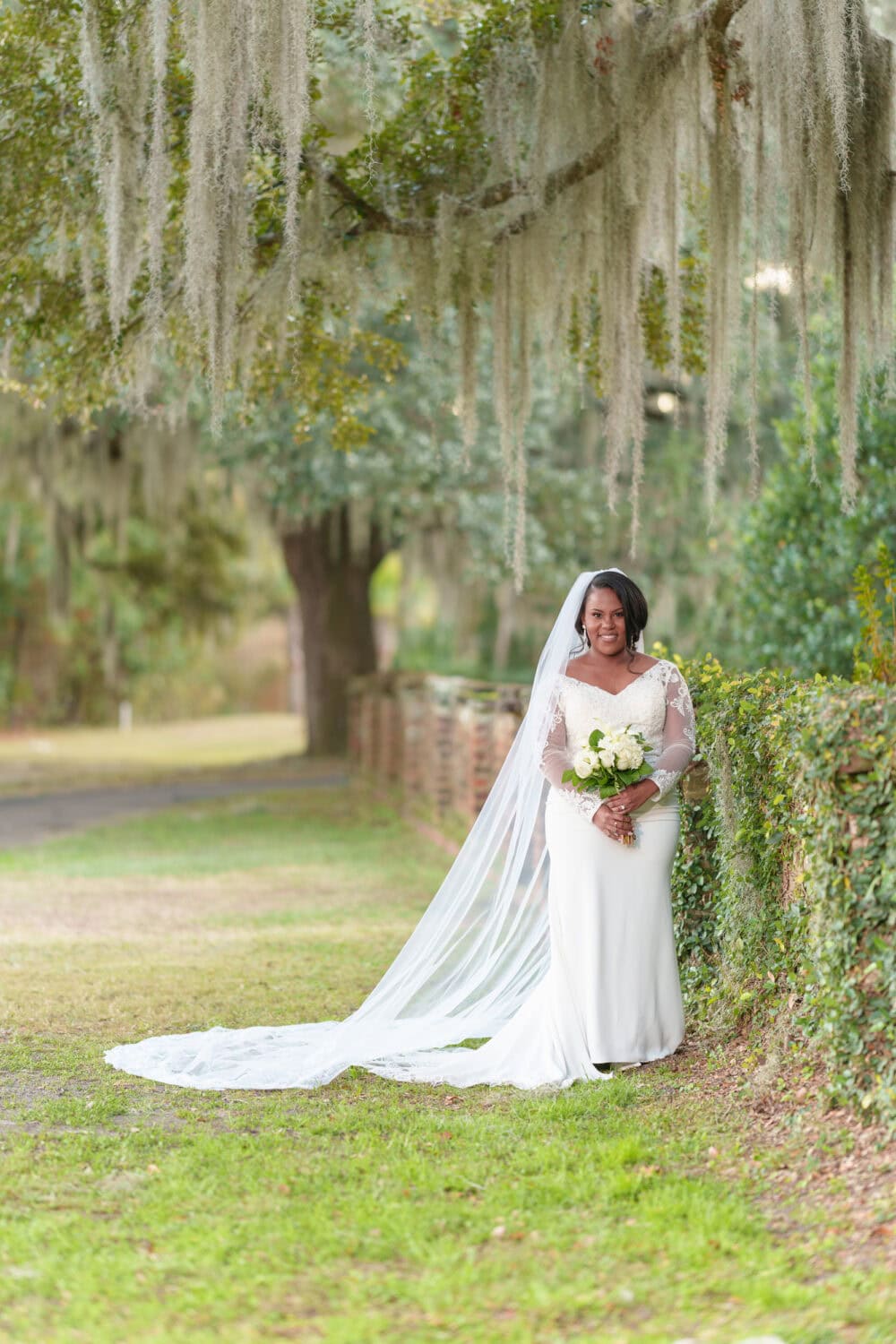 Portraits of the bride by the ivy wall - Wedgefield Country Club