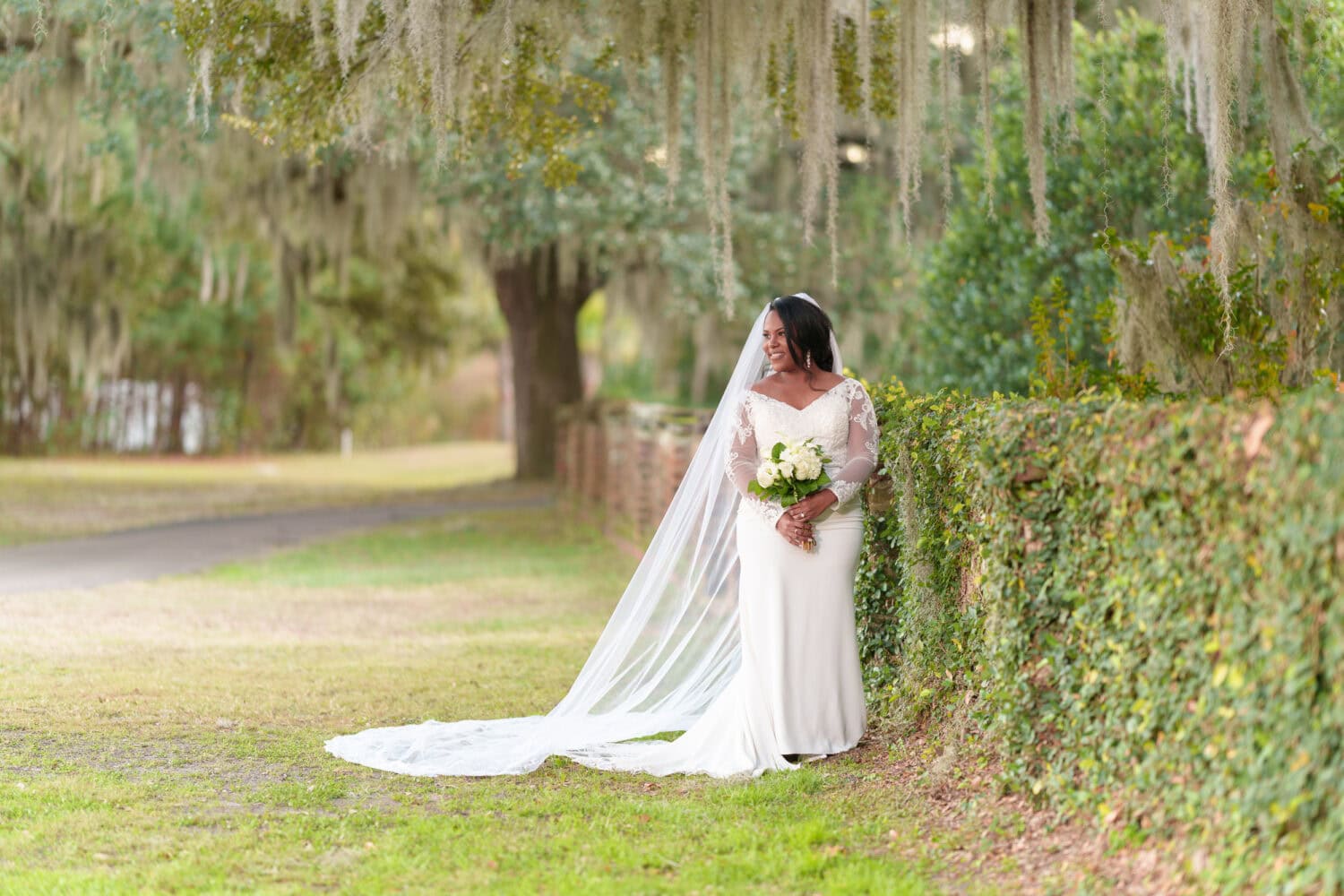 Portraits of the bride by the ivy wall - Wedgefield Country Club