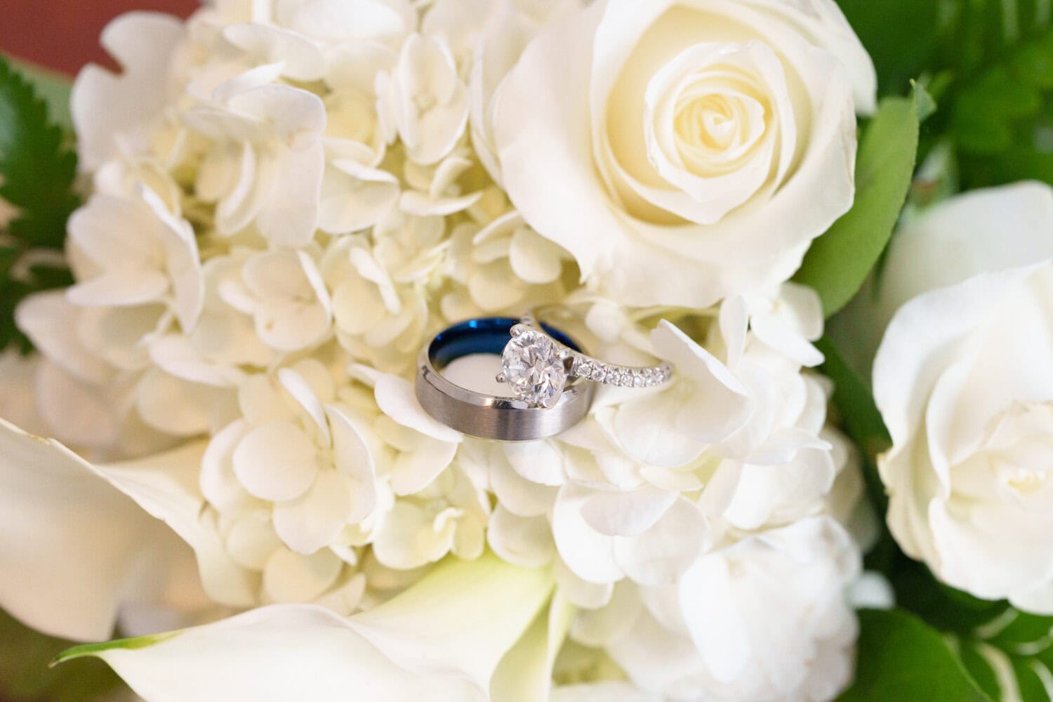 Rings laying on the flowers - Wedgefield Country Club