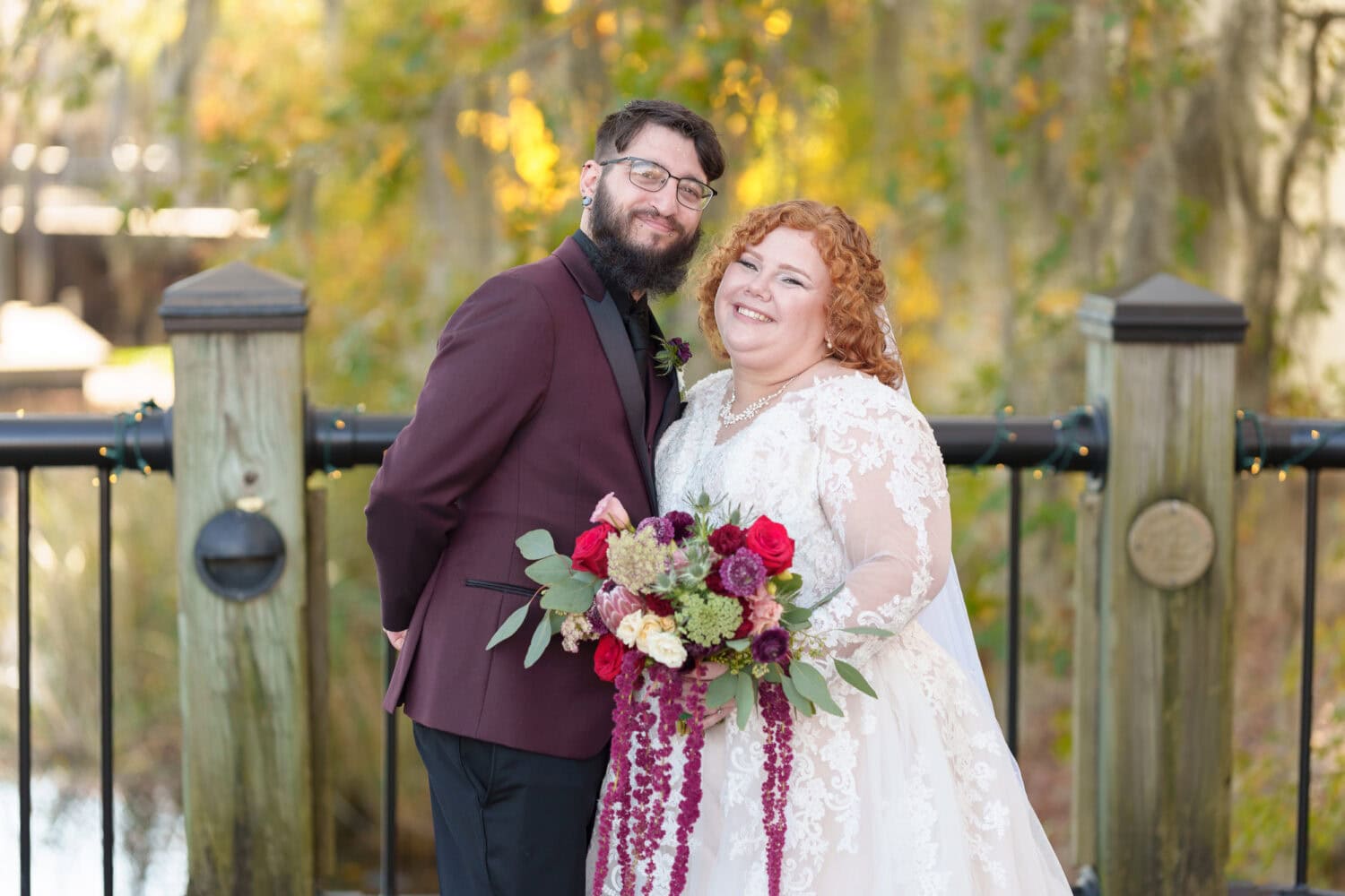 Bride and groom in front of the trees on the riverwalk - The Cypress Inn - Conway, SC