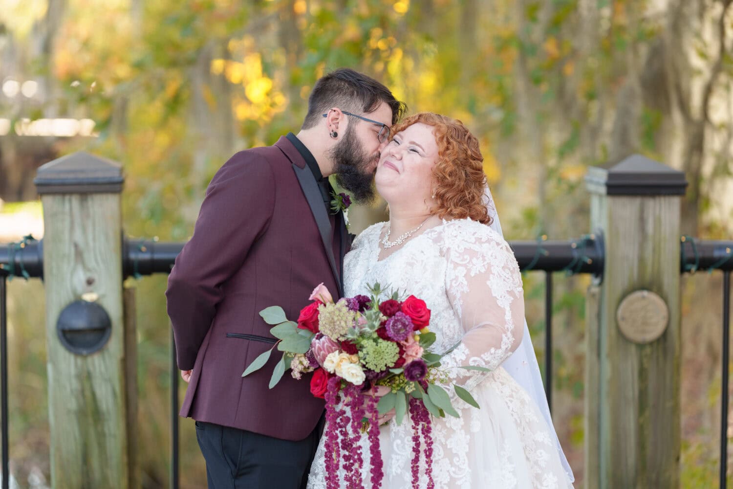 Bride and groom in front of the trees on the riverwalk - The Cypress Inn - Conway, SC