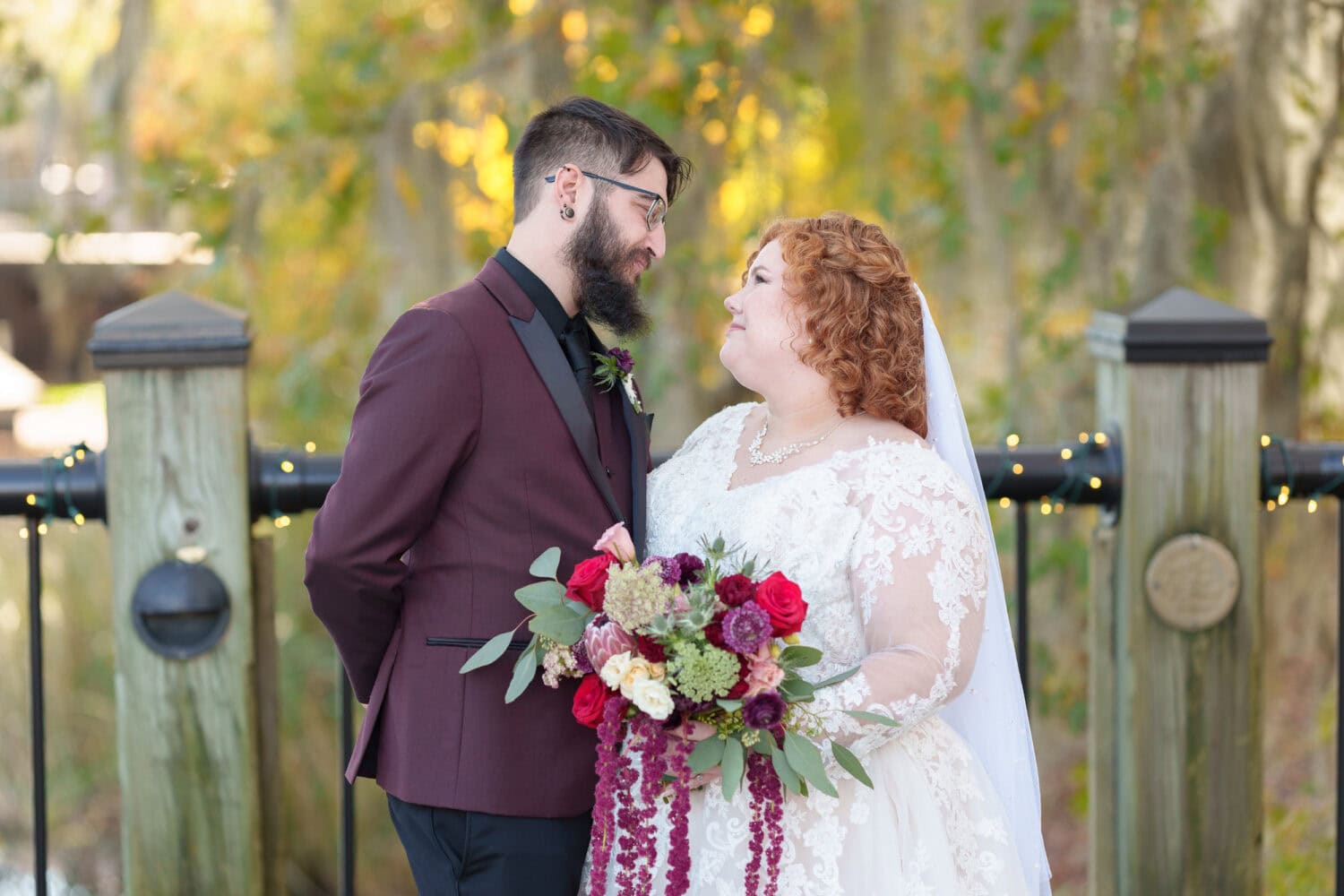 Bride and groom in front of the trees on the riverwalk - The Cypress Inn - Conway, SC