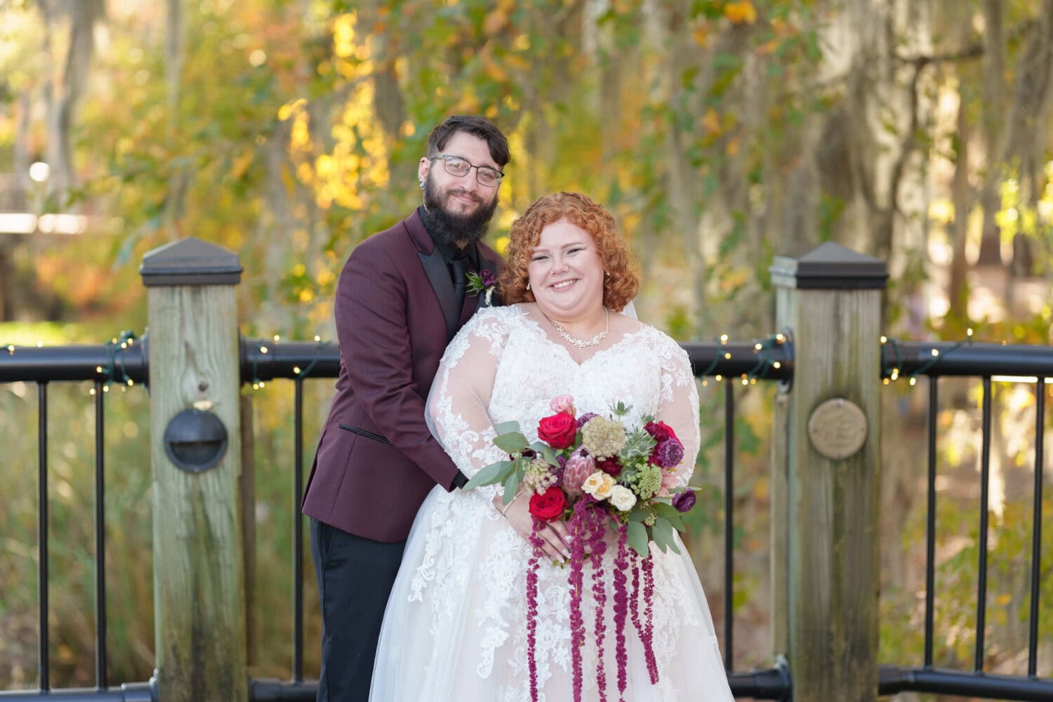 Bride and groom in front of the trees on the riverwalk - The Cypress Inn - Conway, SC