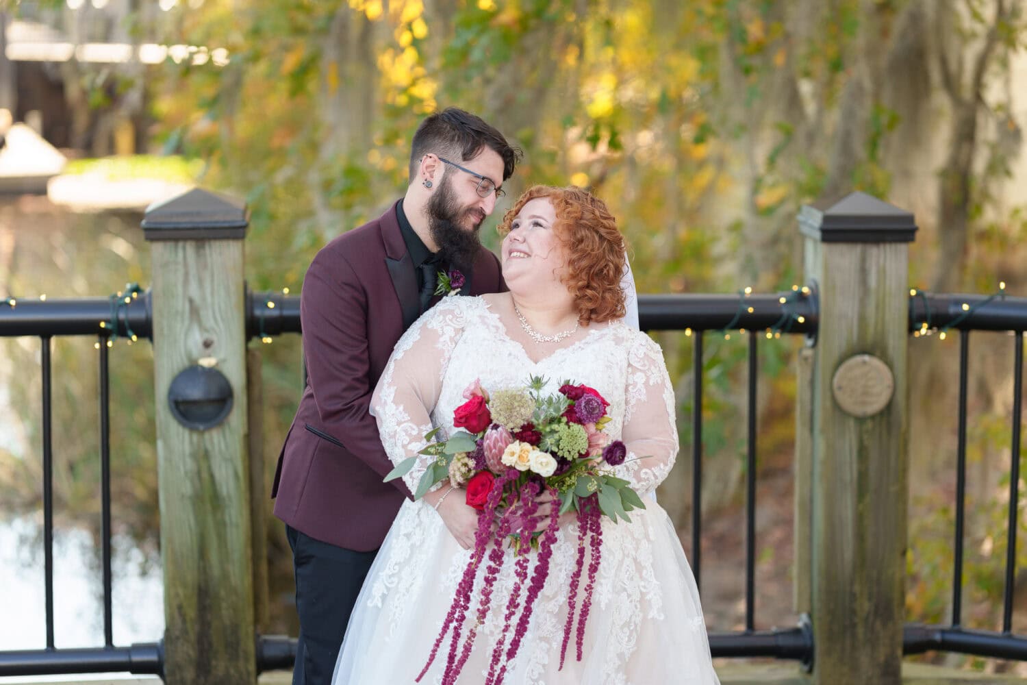 Bride and groom in front of the trees on the riverwalk - The Cypress Inn - Conway, SC