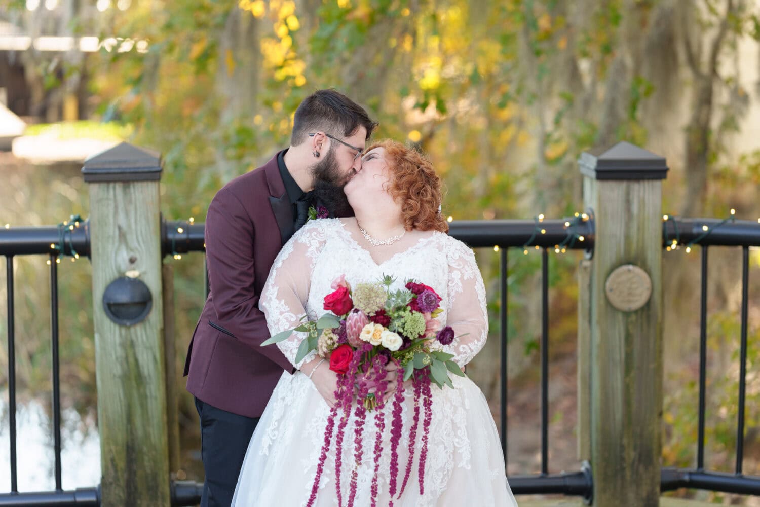 Bride and groom in front of the trees on the riverwalk - The Cypress Inn - Conway, SC